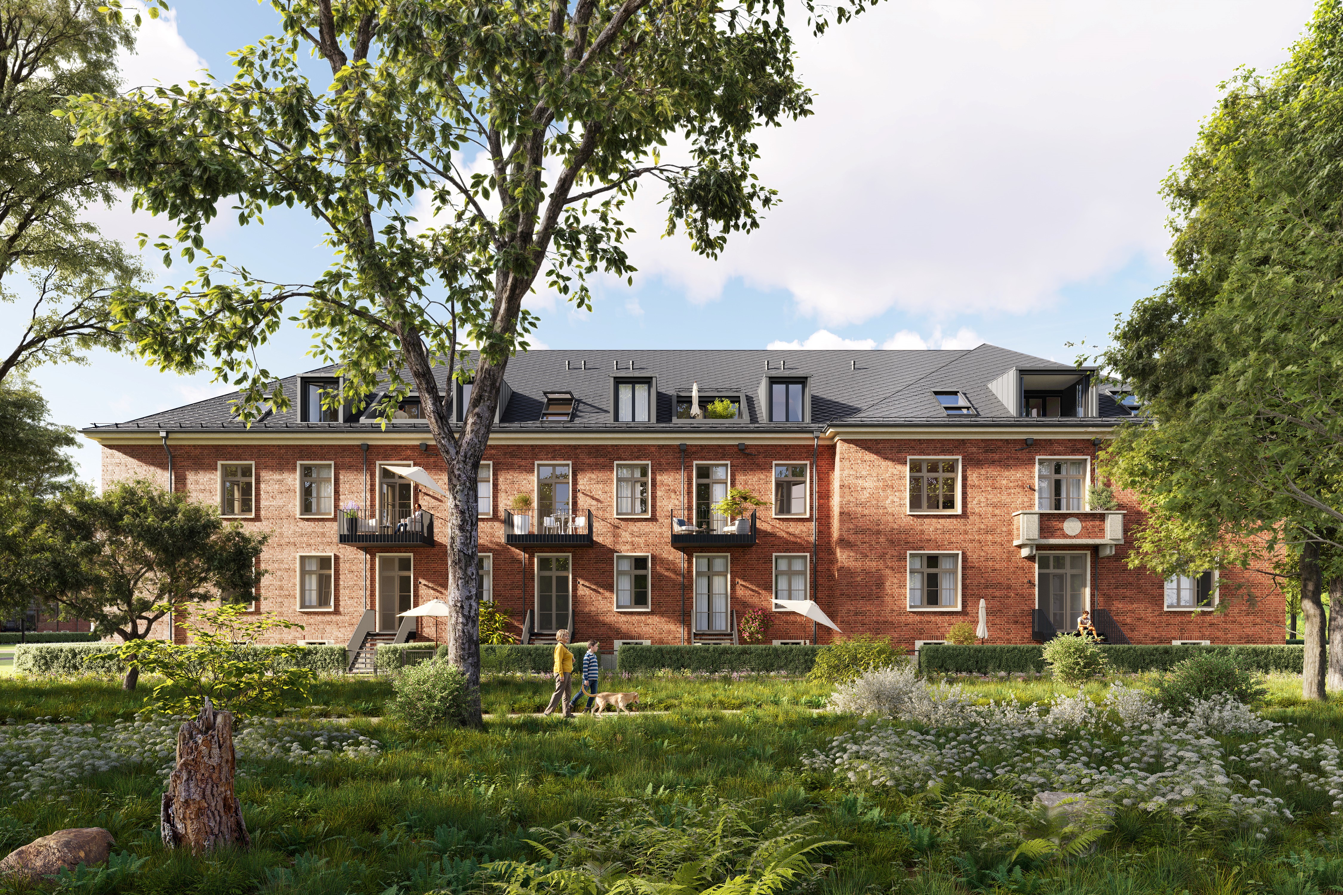 A brown house from the BUWOG Lillestad project with green areas and people can be seen from the front.