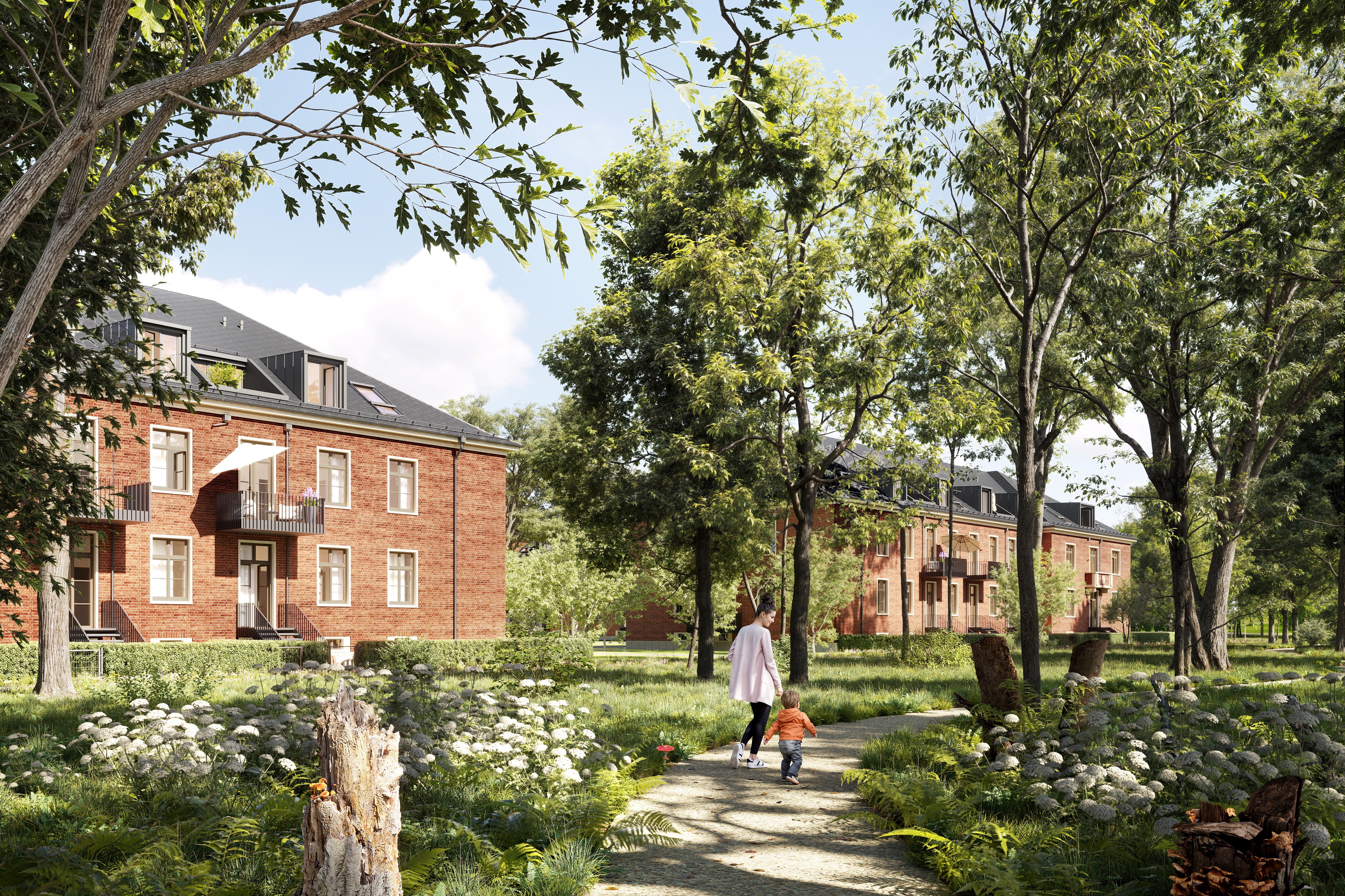You can see several brown houses of the BUWOG Lillestad project with a walkway with people and a large green area.