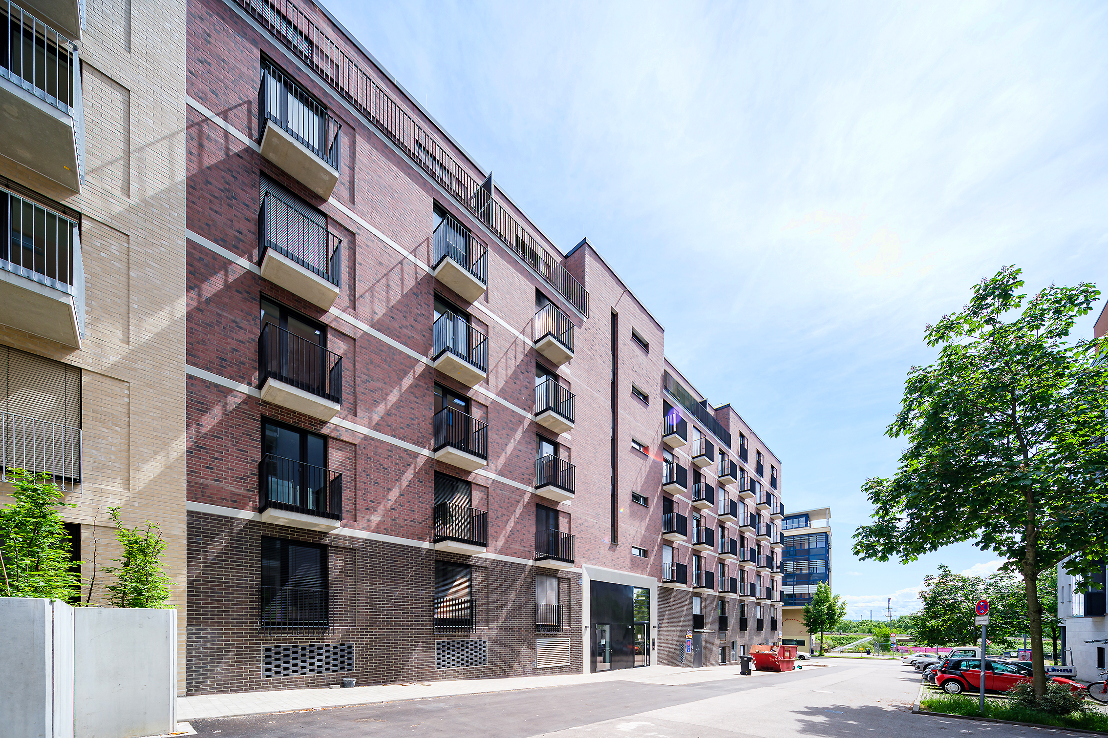 You can see a building in the Rosenstein Mitte quarter with a view of the brown house from the side of the street.